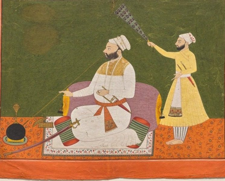 Raja Bikram Singh of Guler smoking a hookah