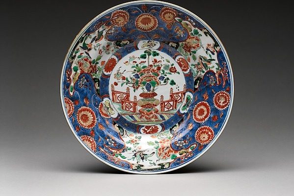 Dish with a vase of flowers